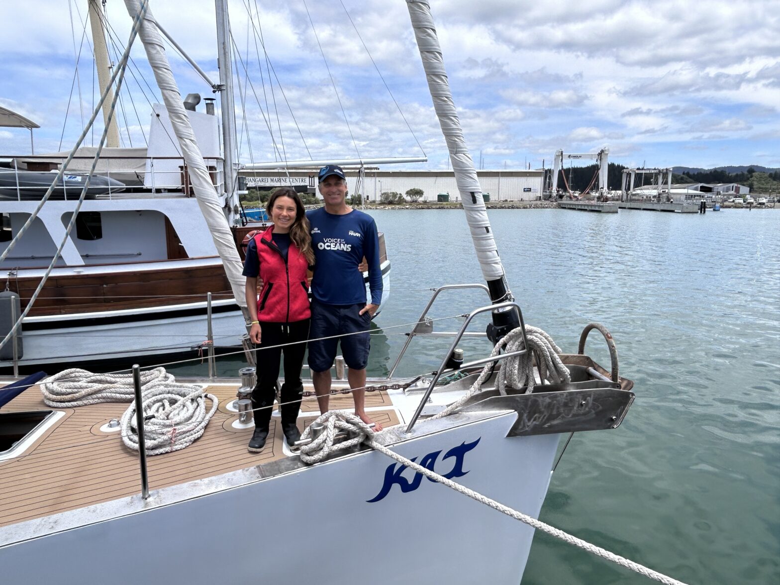 Voice of the Oceans crew standing on Kat, their sailing catamaran